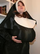 Topless nun with gigantic breasts bares her huge boobs at Big Tits Glamour - 38LL Anorei Collins from BigTitsGlamour.com