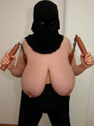 Ninja tits with Maxi 32JJ as a topless ninja with katana Samurai sword and nunchucks and sai stuck in her massive breasts in nunchuck titfuck photos from TopHeavyAmateurs.com