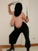 Ninja tits with Maxi 32JJ as a topless ninja with katana Samurai sword and nunchucks and sai stuck in her massive breasts in nunchuck titfuck photos from TopHeavyAmateurs.com