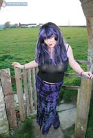 Vix goes goth tits-out in the graveyard at her BreastFiles Playmate Site