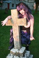 Vix goes goth tits-out in the graveyard at her BreastFiles Playmate Site