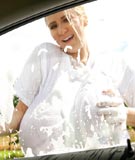 Abbi Secraa biggest breasts in a wet t-shirt plus huge tits pressed against glass in big boobs sexy topless car wash photos from AbbiSecraa.com