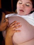 Anorei Collins tit-sucking pregnant lesbian giant breast fetish nipple suckling macromastia photos from AnoreiCollins.com